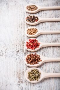 Spices on wooden spoon