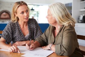 Female financial advisor Helping Senior Woman with wealth management